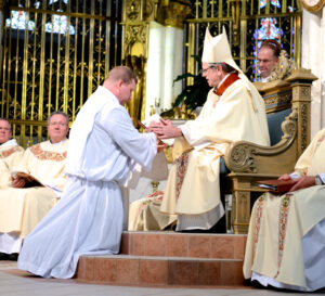 Bishop George Leo Thomas ordains John Crutchfield a transitional deacon on June 21, 2013 in Helena, Montana. Photo courtesy: Eric Connolly, Montana Catholic.