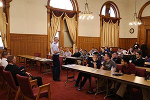 U.S. Air Force Chaplain Father Tom Foley talks with retreatants.