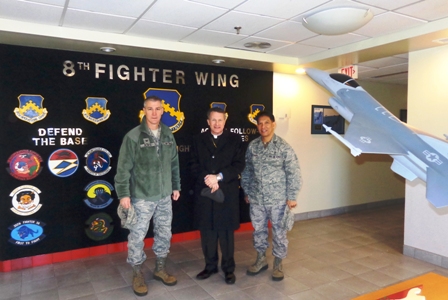 Archbishop Timothy Broglio in South Korea with Col. John W. Pearse, Commander at Kunsan Air Base (left) and Father Mario Catungal.