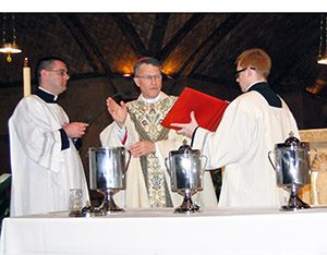Archbishop Timothy P. Broglio blesses oils at 2015 chrism Mass for theArchdiocese for the Military Services, USA, on March 23, 2015, in Washington,D.C.