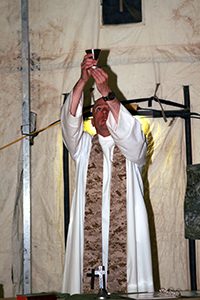 Father Christopher S. Fronk, S.J., CHC, CDR, USN, celebrates Mass during a 2011-2012 deployment to Afghanistan.