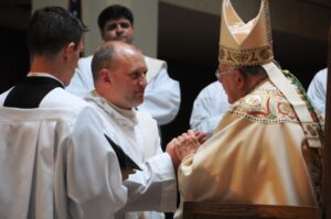 Father Jason Burchell promises obedience to Bishop Paul Loverde during ordination Mass June 8, 2013 in Arlington, Va. Photo courtesy of Katie Bahr,The Arlington Catholic Herald.
