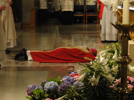  Bishop Robert Coyle lies prostrate before the altar at his episcopal ordination April 25, 2013 at the National Shrine.