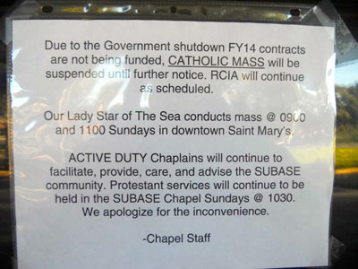 Sign posted at Kings Bay Submarine Base in Georgia notifying Catholics Mass is suspended due to shutdown. Photo courtesy The Thomas More Law Center.