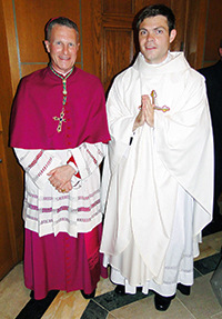  Archbishop Timothy P. Broglio with newly ordained Father Alec Scott on Saturday, June 20, 2015, in Washington, D.C.