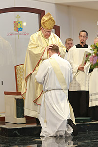 Bishop Robert N. Lynch ordains Father Ryan Boyle on May 16, 2015, in St. Petersburg, Fla. Photo courtesy of Michael Donovan | Life Through the Lens Photography.