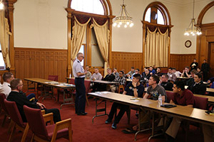 U.S. Air Force Chaplain Father Tom Foley talks with retreatants.