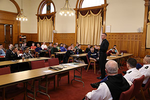 U.S. Navy Chaplain Father Ben Garrett talks with retreatants.