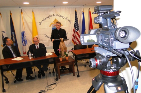 Jose Amaya and Dr. Mark Moitoza listen as Archbishop Broglio talks to AMS ministry leaders throughout the U.S. and in Europe via live stream.